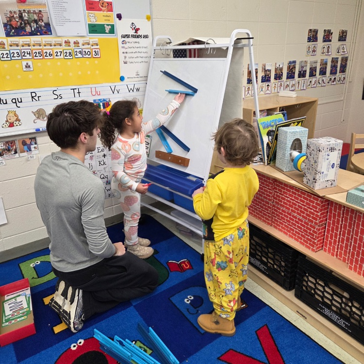NHS student helping preschool students 