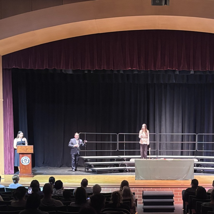 One student taking the oath of the French Language Honor Society
