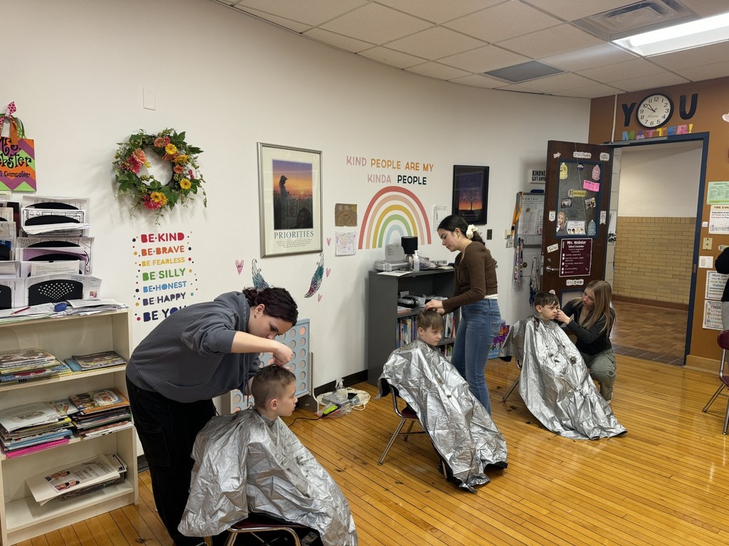 Bush Campus cosmetology students cutting hair for local elementary school