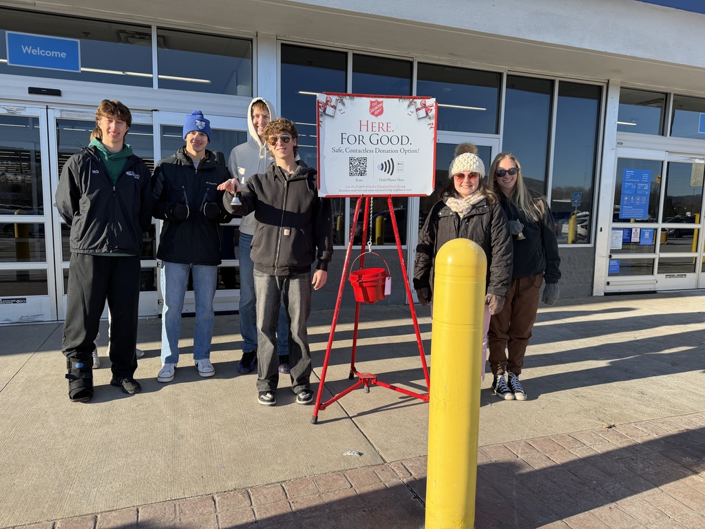 Engineers and Human Service & Education students ringing the bell at Walmart. 