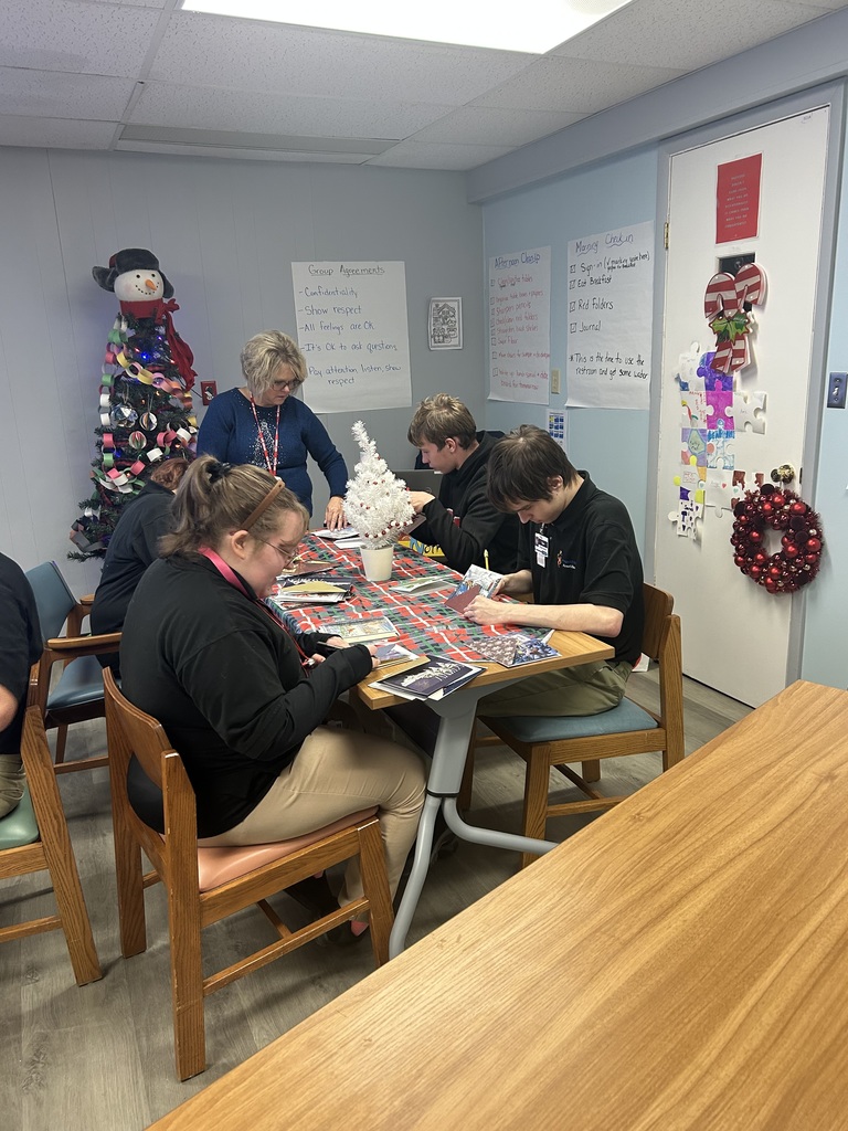 students signing cards
