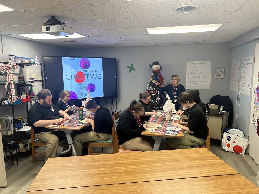 card signing by a group of students