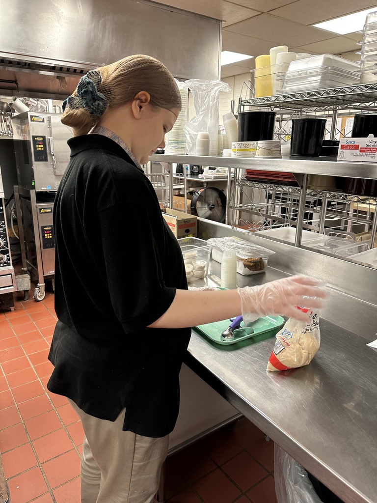 Intern preparing food for cafeteria. 