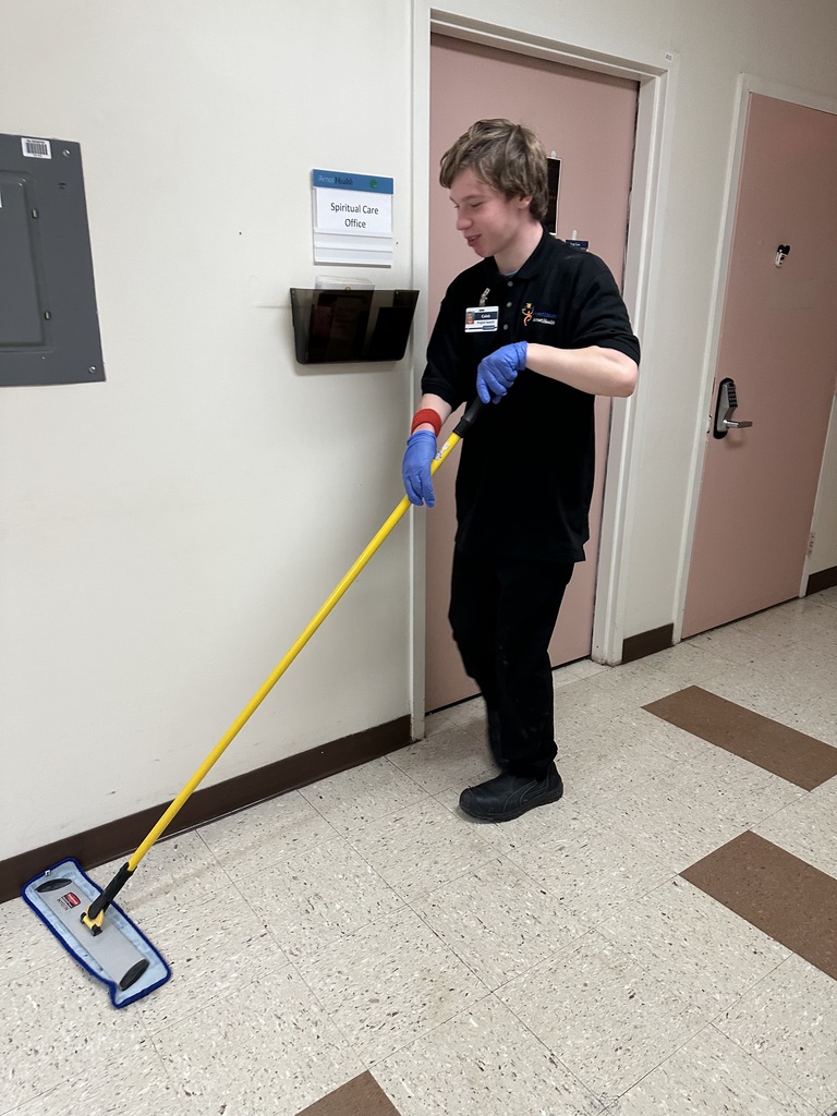 Intern mopping floor