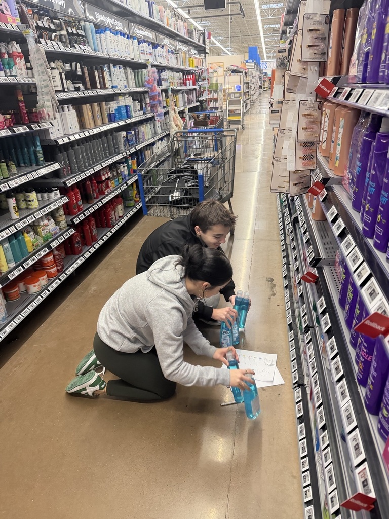 students checking products
