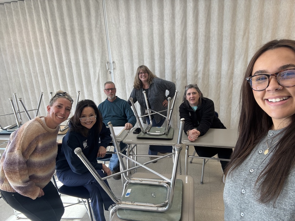 staff smiling while collaborating