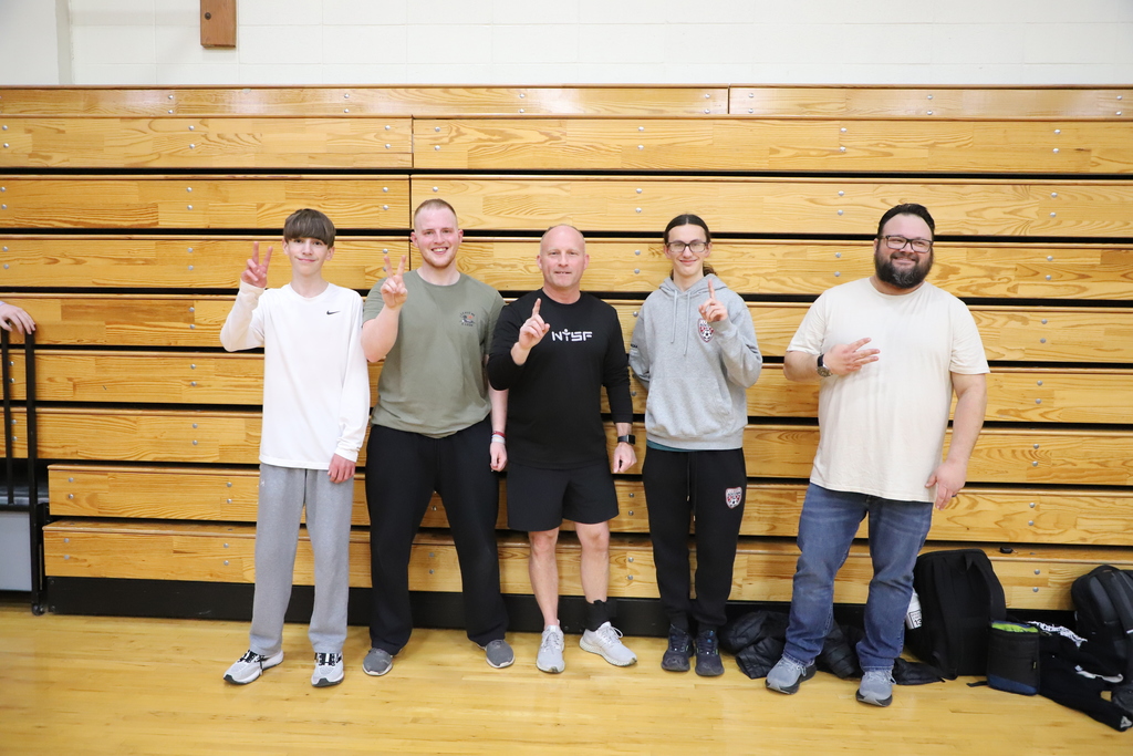 Staff celebrating a victory win at pickleball
