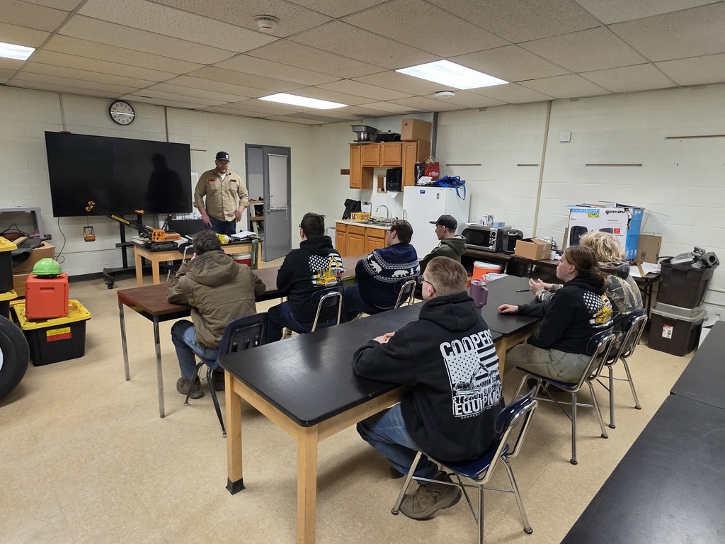 SR  Heavy Equipment students getting some valuable information before putting it together hands on with the crane.