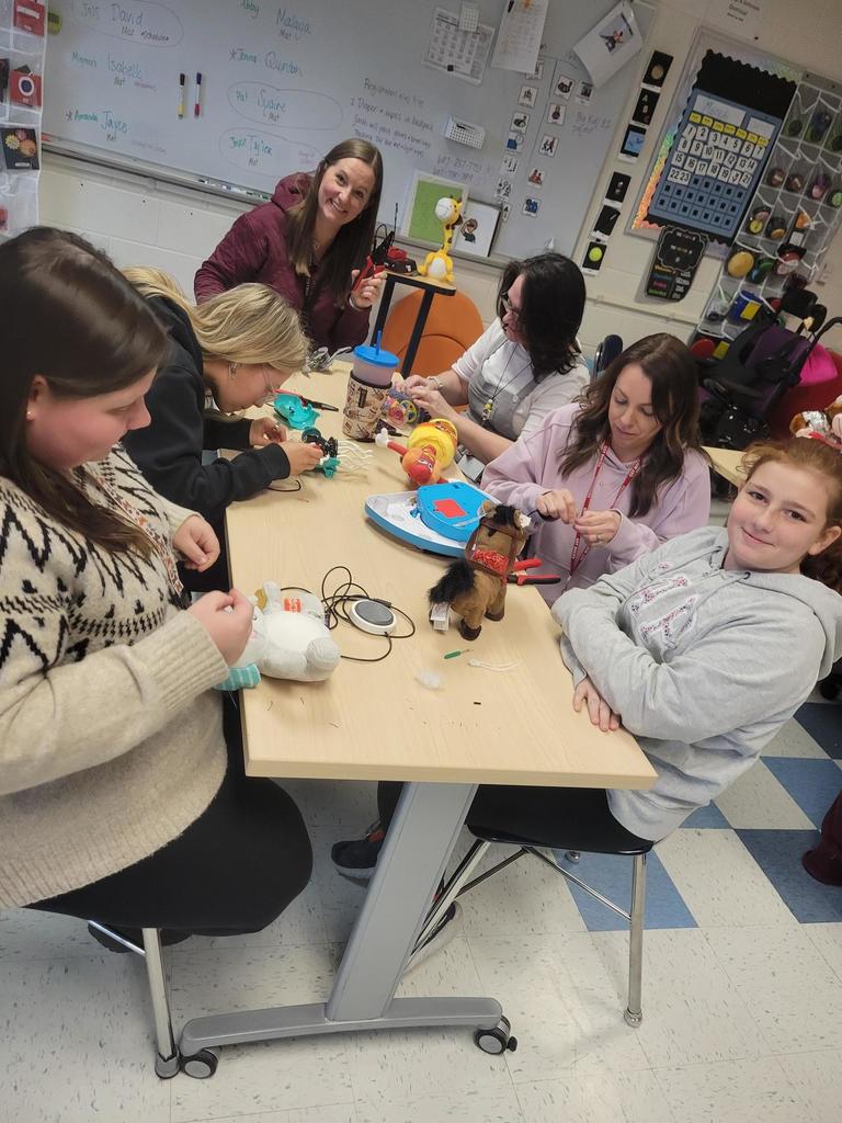 A room full of instructional professionals learning more about adaptive toys.