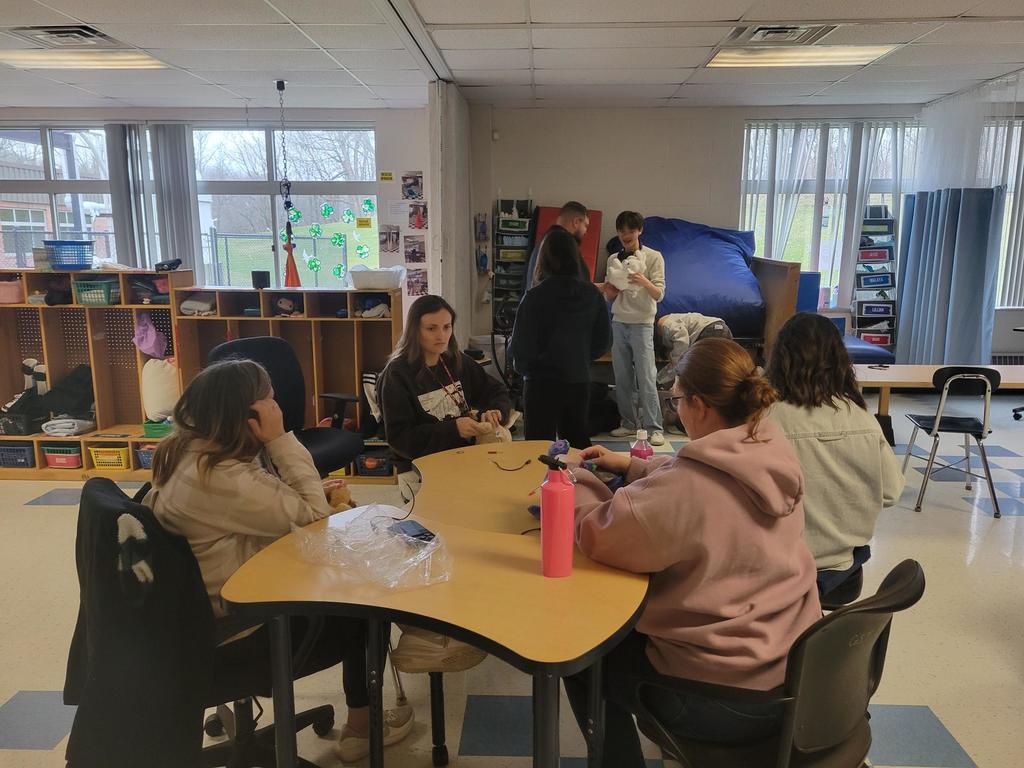 A room full of instructional professionals learning more about adaptive toys.