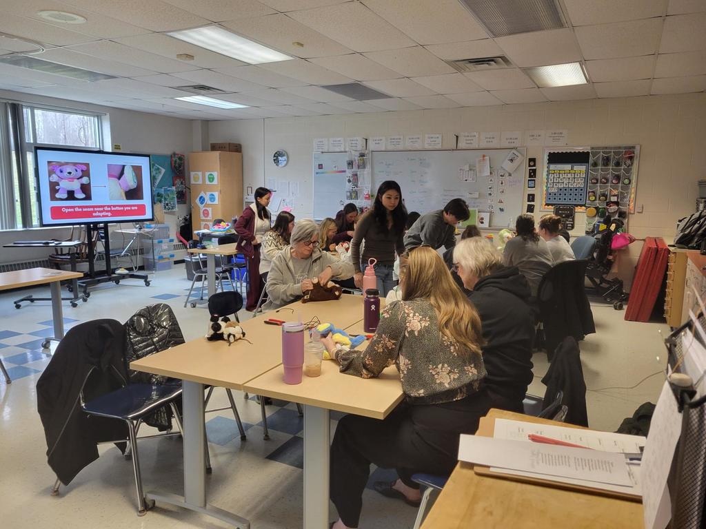 A room full of instructional professionals learning more about adaptive toys.