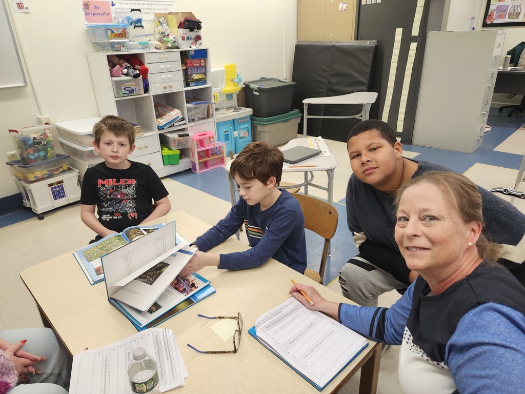 Teacher and students in science lesson.