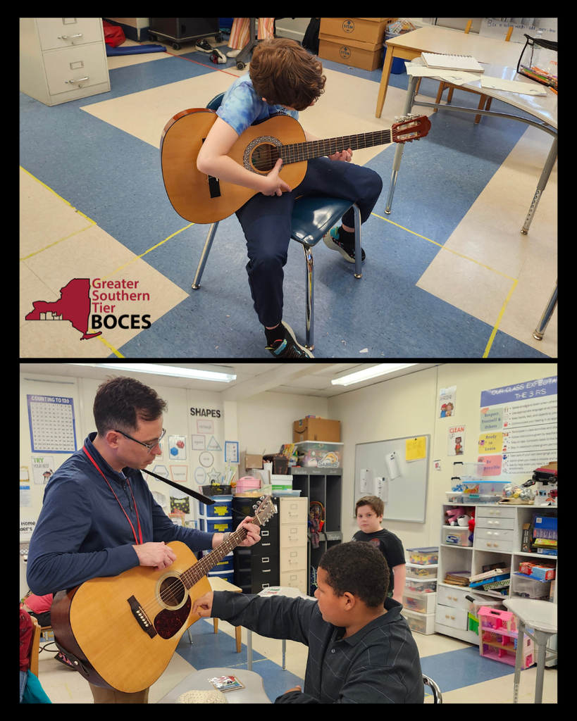 Students learning to play the guitar.