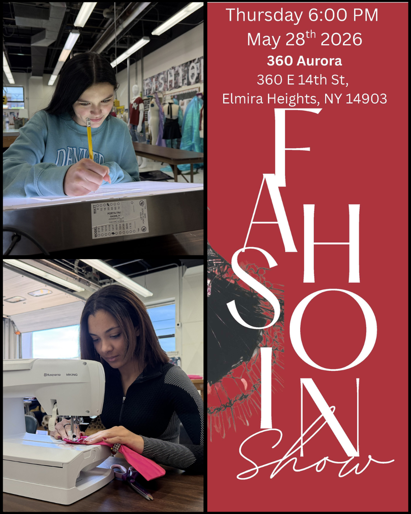Two students working on articles for the upcoming Fashion Show with details of the event.