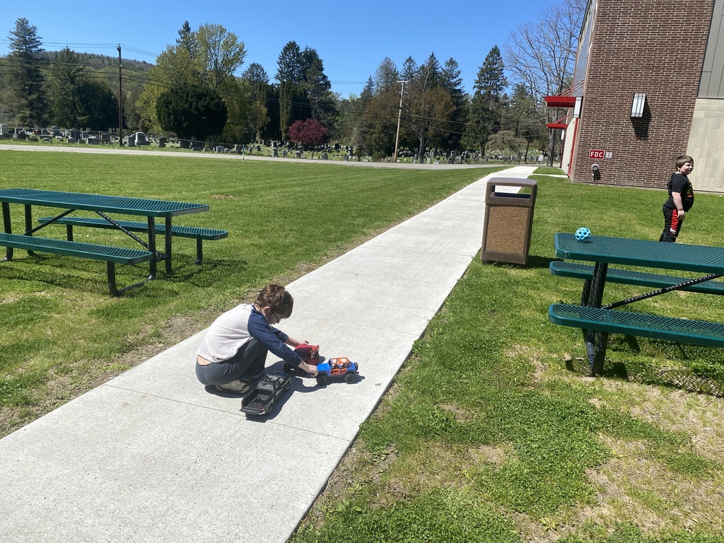 Two students playing in the sun