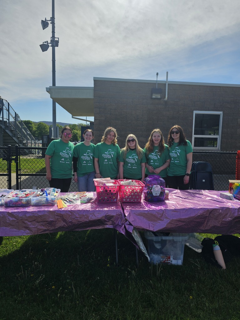 Wildwood Campus Cosmetology students in a group photo wearing green "Girls on the Run" t-shirts.