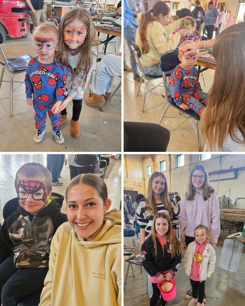 Kids with their faces painted by cosmetology students