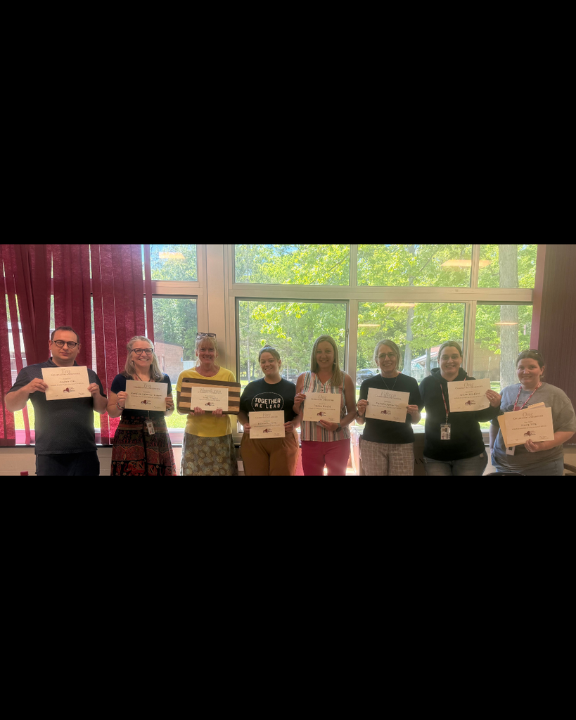 Wildwood staff holding certificates