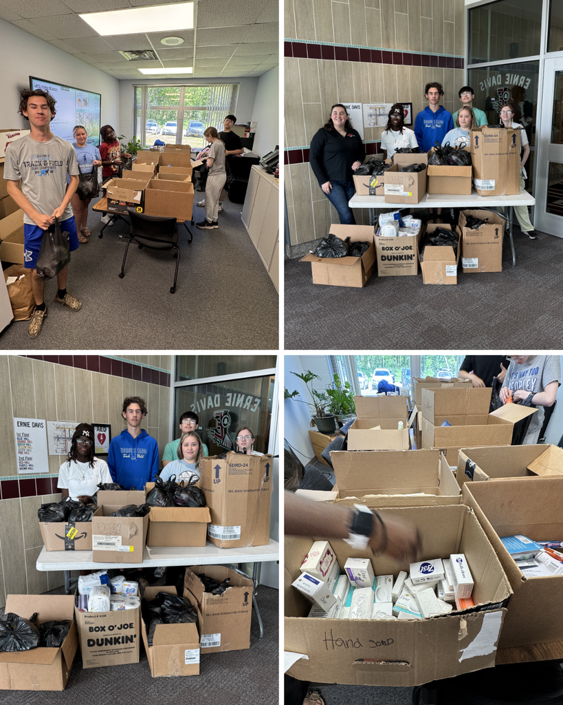 students with boxes of donations