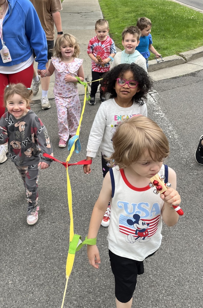 Preschoolers in a line making music