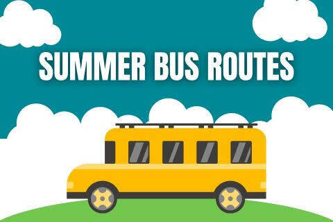 Yellow school bus with summer bus routes above it