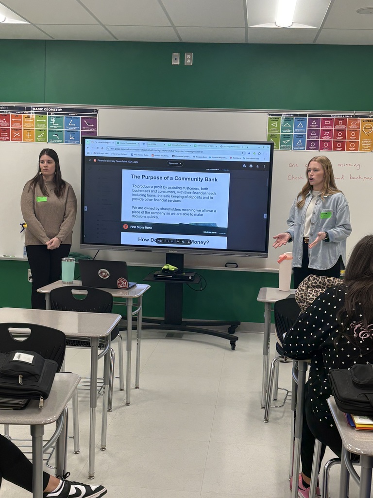 First State Bank employees discussing the banking industry