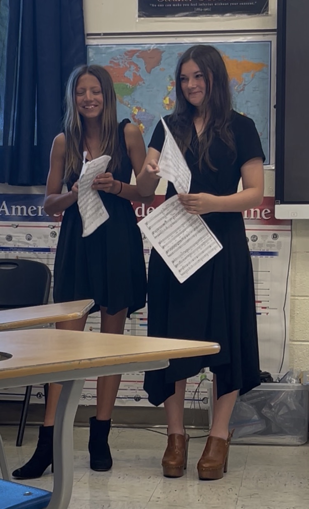 Kyla Jasper, 7th, and Esmay Blackmore, 8th, performing their vocal duet 