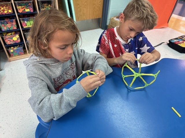 Students conducting 3D shapes.