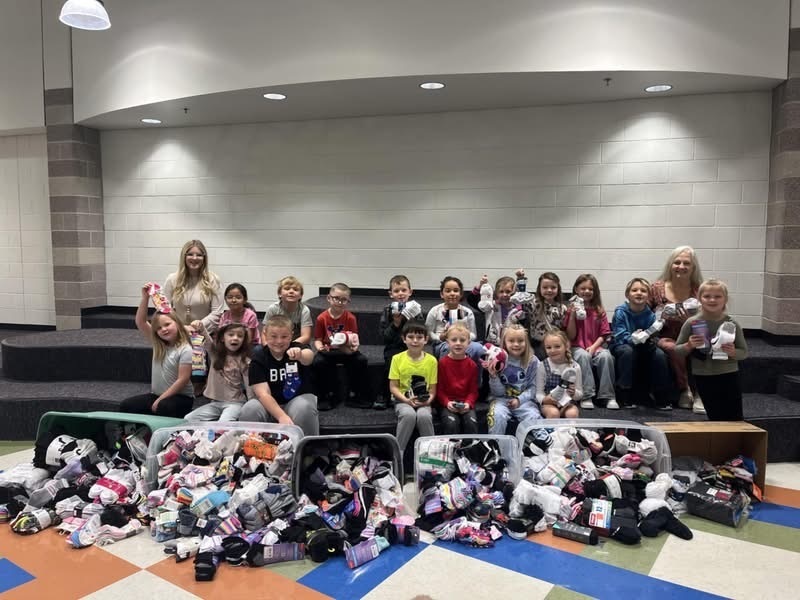 Ms. Callison’s class pictured with the collection of socks.