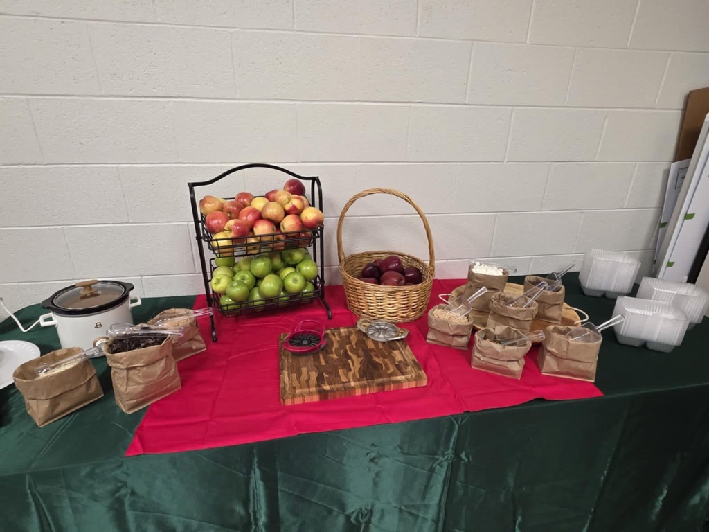 Table spread of apples and toppings for teachers