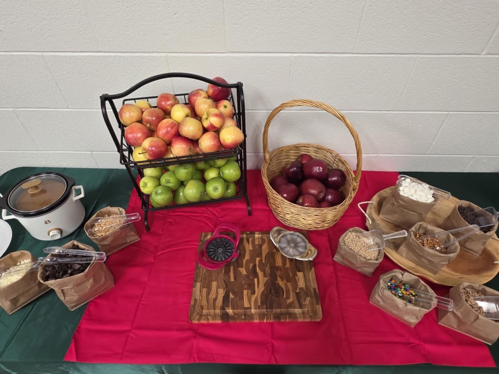 Table spread of apples and toppings for teachers