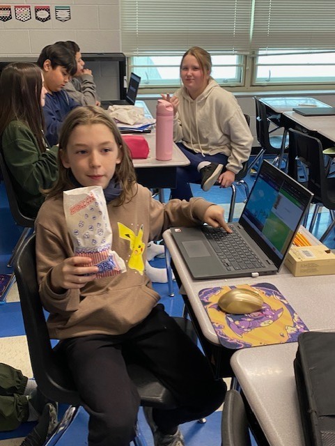 Fifth Grade eating popcorn from PTO