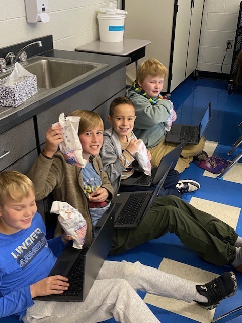 Fifth Grade eating popcorn from PTO