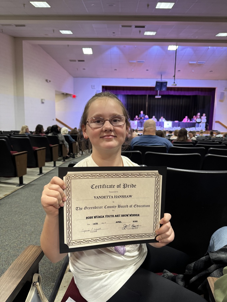 Vandetta holding her certificate for placing 3rd in Mixed Media in the WVAEA Youth Art Month Exhibition 