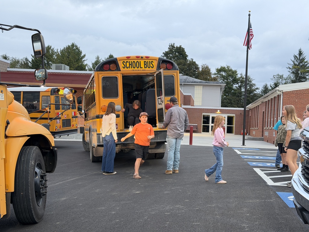 Students practicing bus evacuation drills