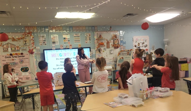 Students standing up in the classroom