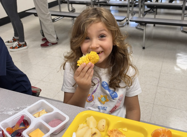 students eating corn