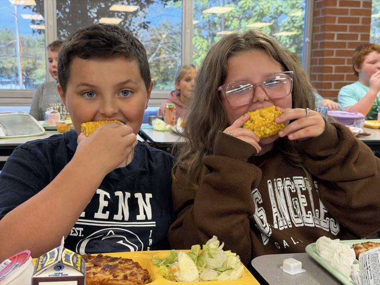 students eating corn