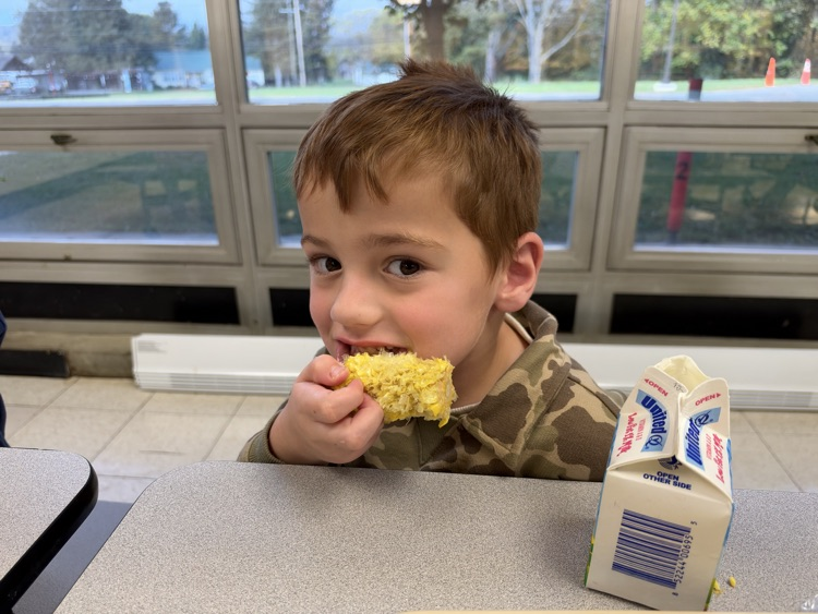 students eating corn