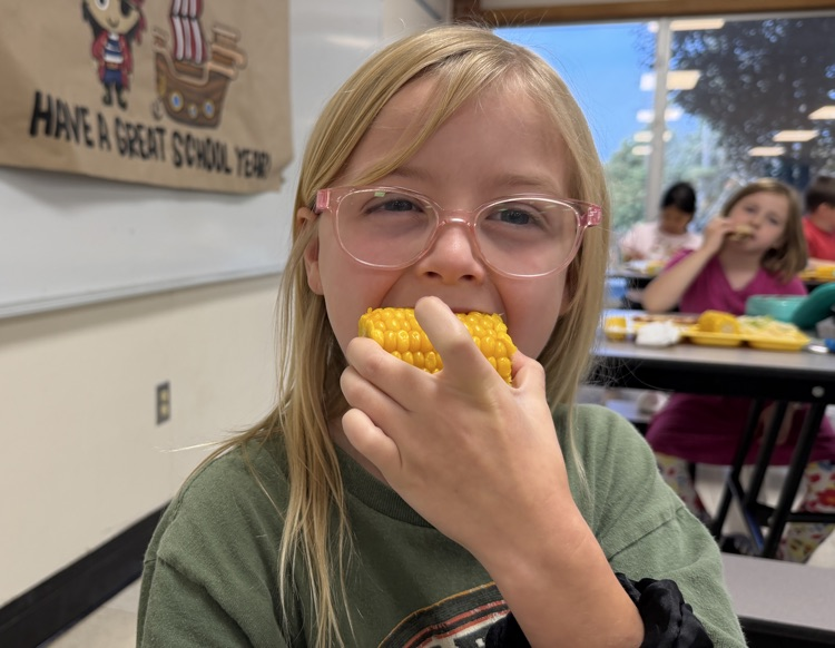 students eating corn