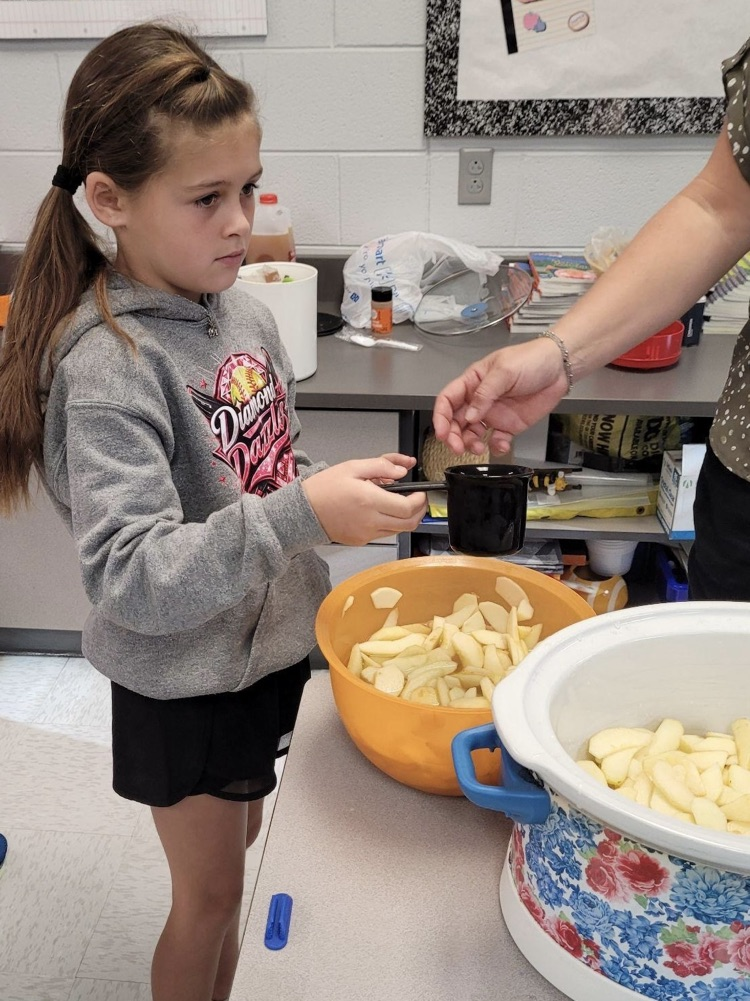 student using a measuring cup