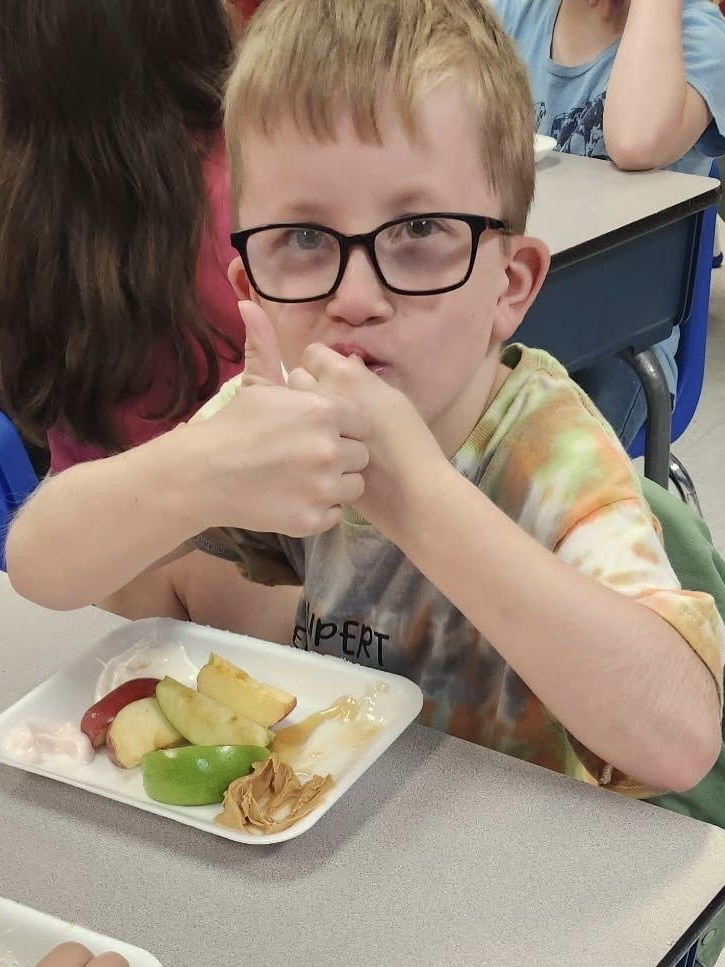 student biting an apple