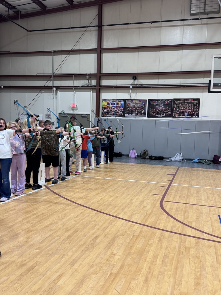 Archers releasing their arrows at the targets.