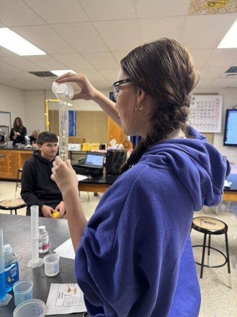 student doing science project