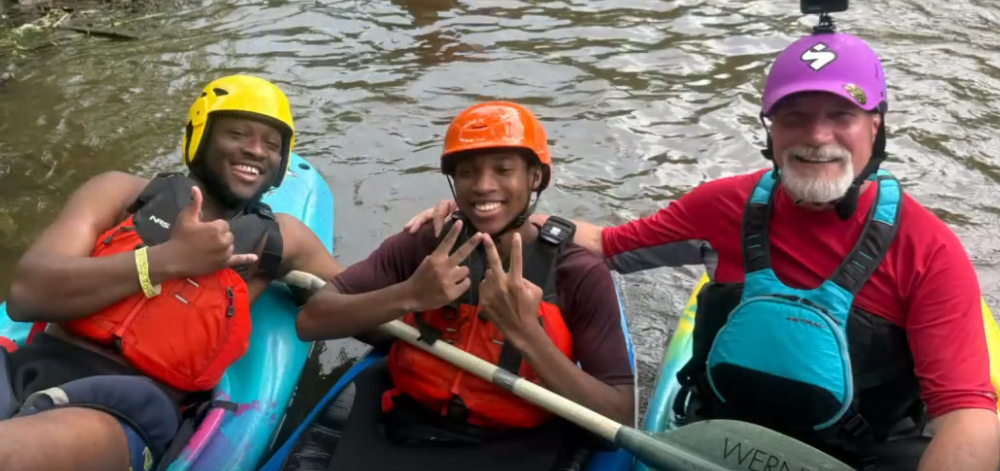 three guys in kayaks