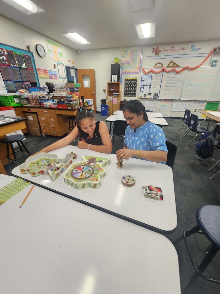 Student and teacher playing Board Games