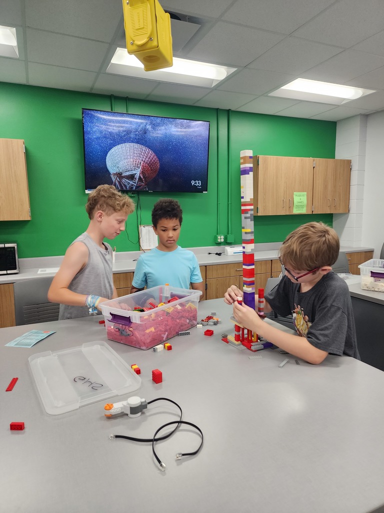Kids making a huge Lego tower