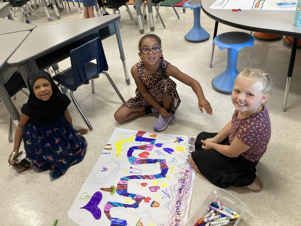 Smiling students with their music game.