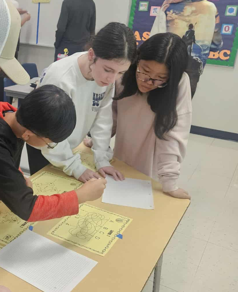 Algebra 8th Grade Students completing math puzzles