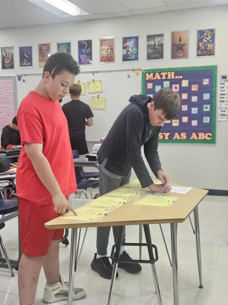 Algebra 8th Grade Students completing math puzzles